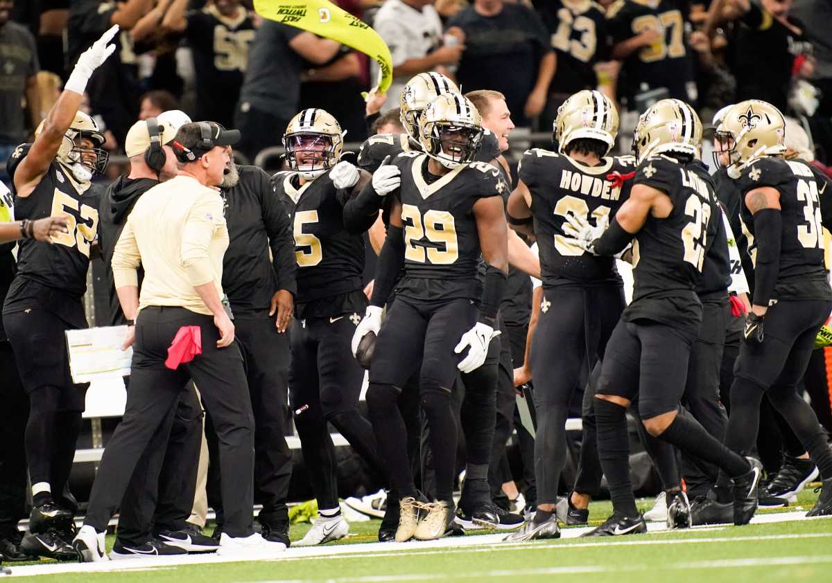 New Orleans Saints cornerback Paulson Adebo (29) celebrates intercepting a Titans pass